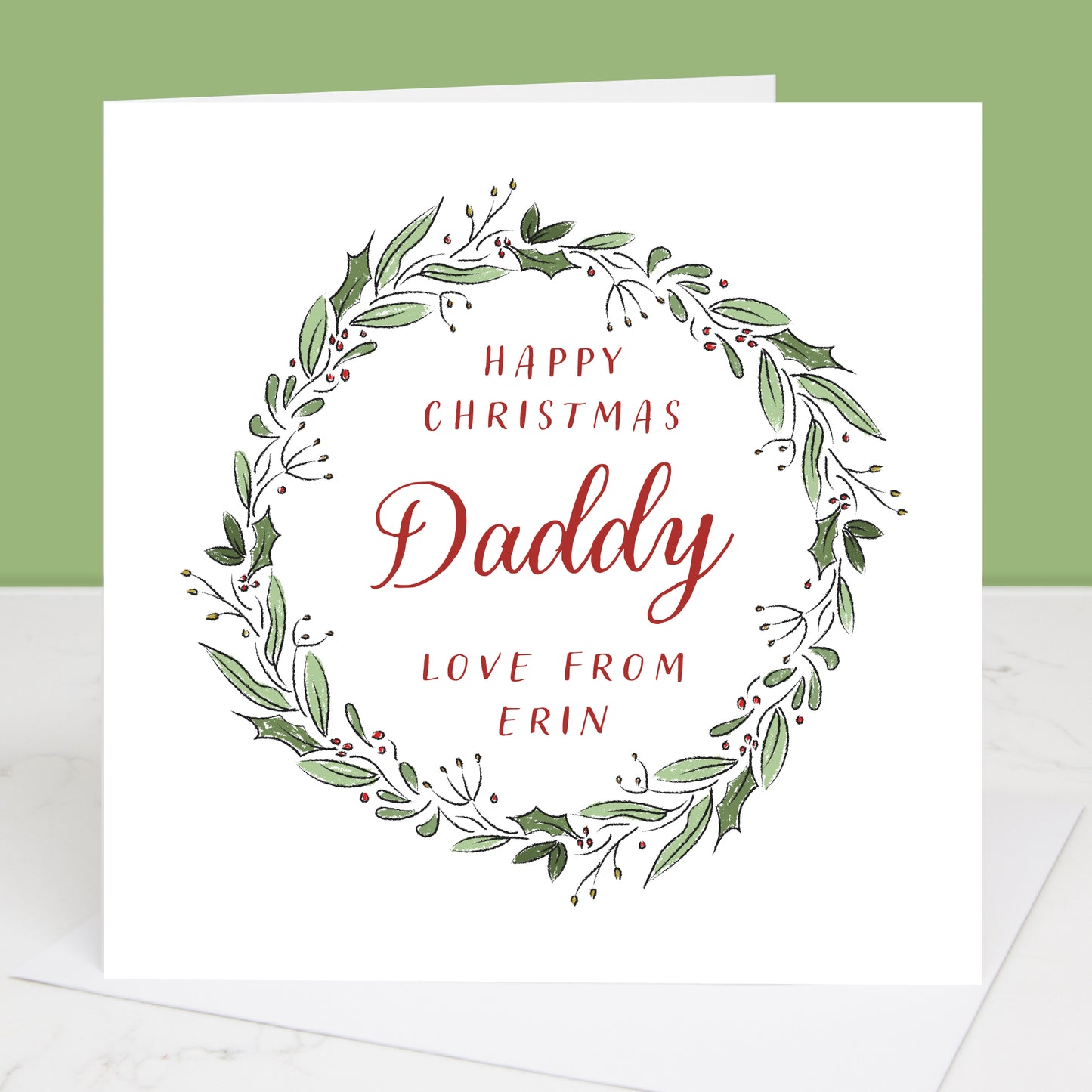 Christmas card for Daddy with green wreath and red text on a white background
