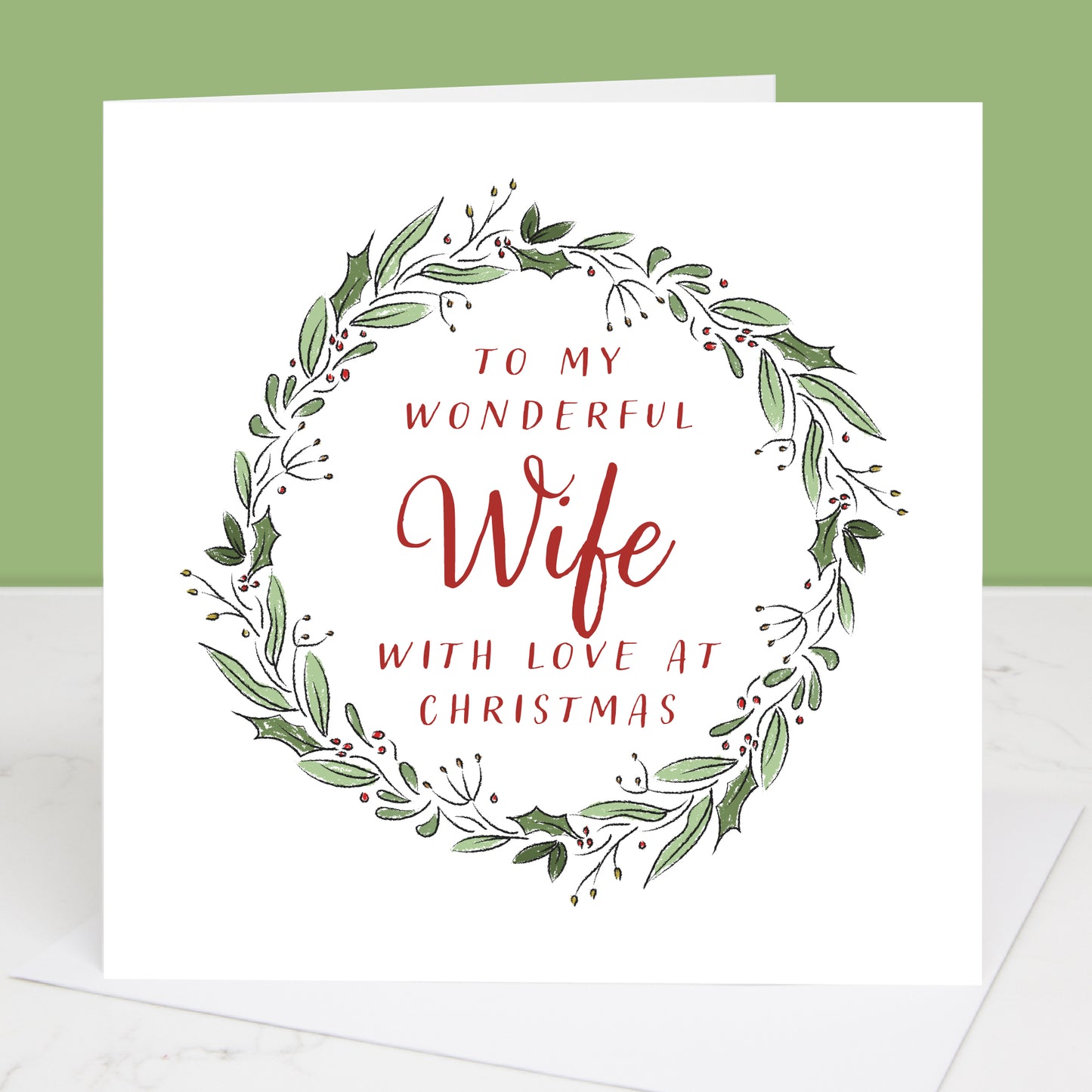 Greeting card with festive wreath design and text 'To my wonderful Wife with love at Christmas' on a white background.