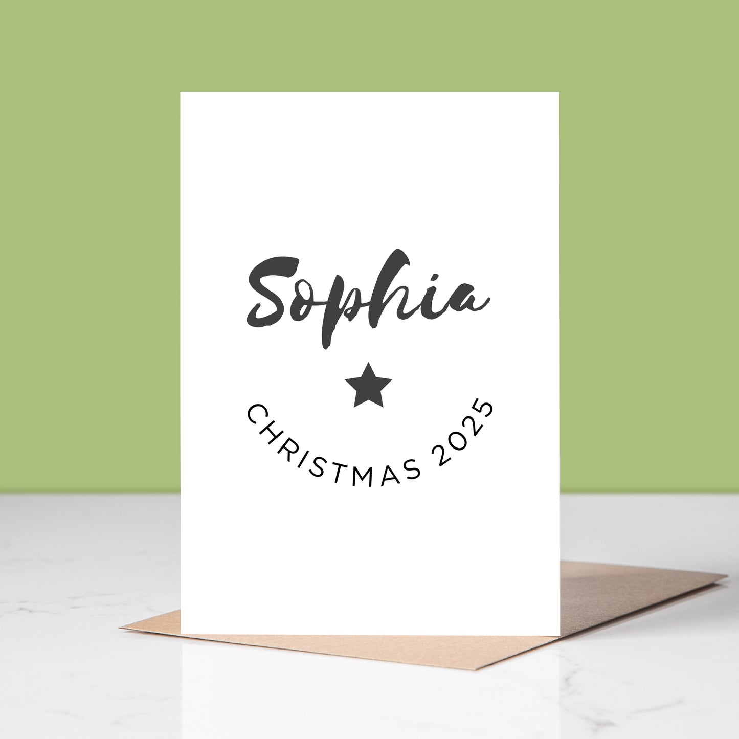 White card with name and Christmas 2025 text on a light green background