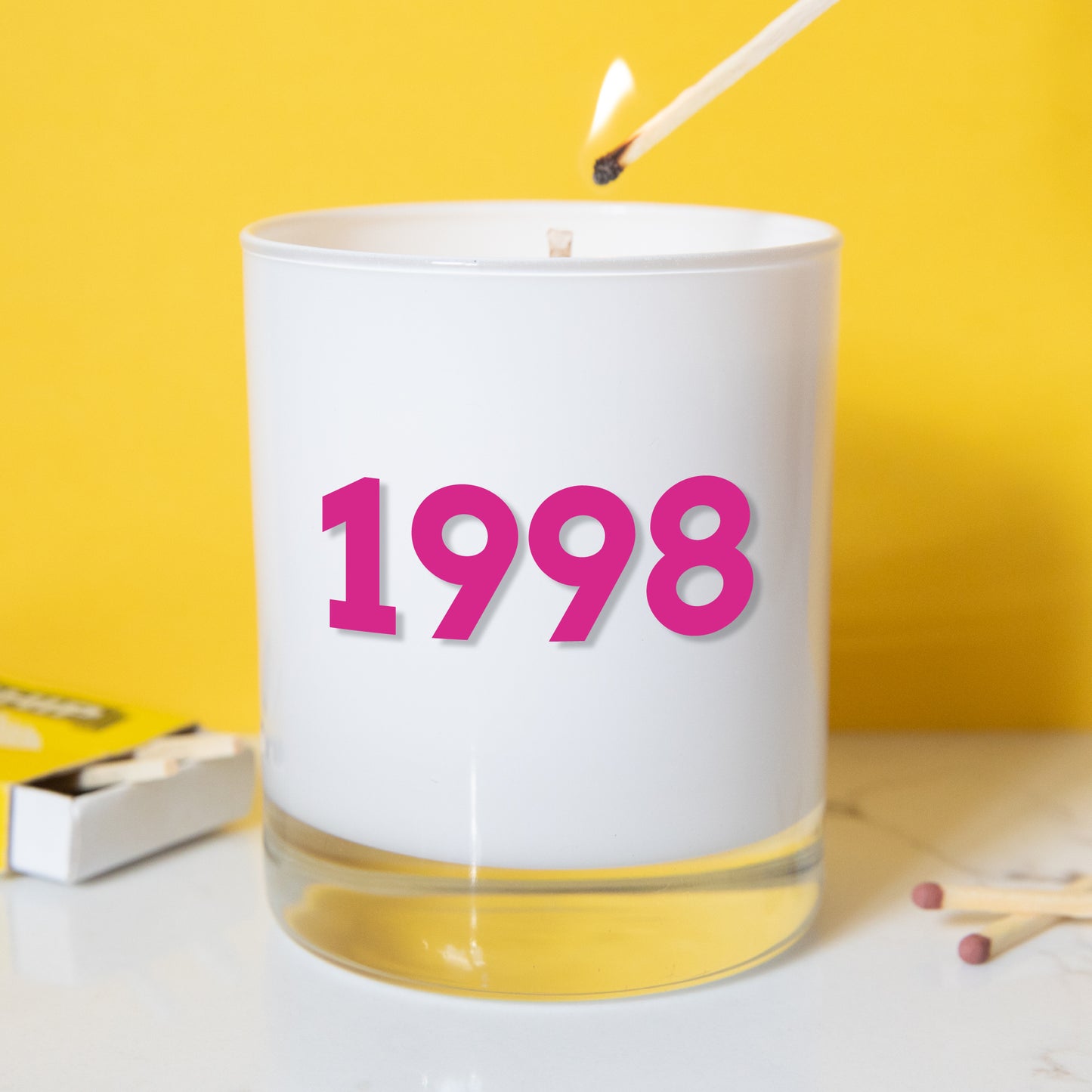 Glad candle holder with hand poured soy wax with year of birth printed in pink  . All images © Slice of Pie Designs