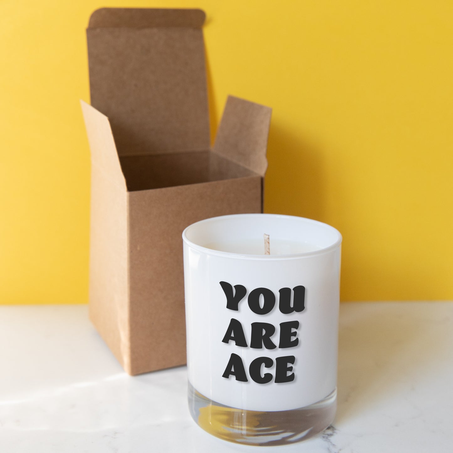 Soy wax candle in white class container printed with You Are Ace shown with gift box. All images and designs ©  Slice of Pie Designs
