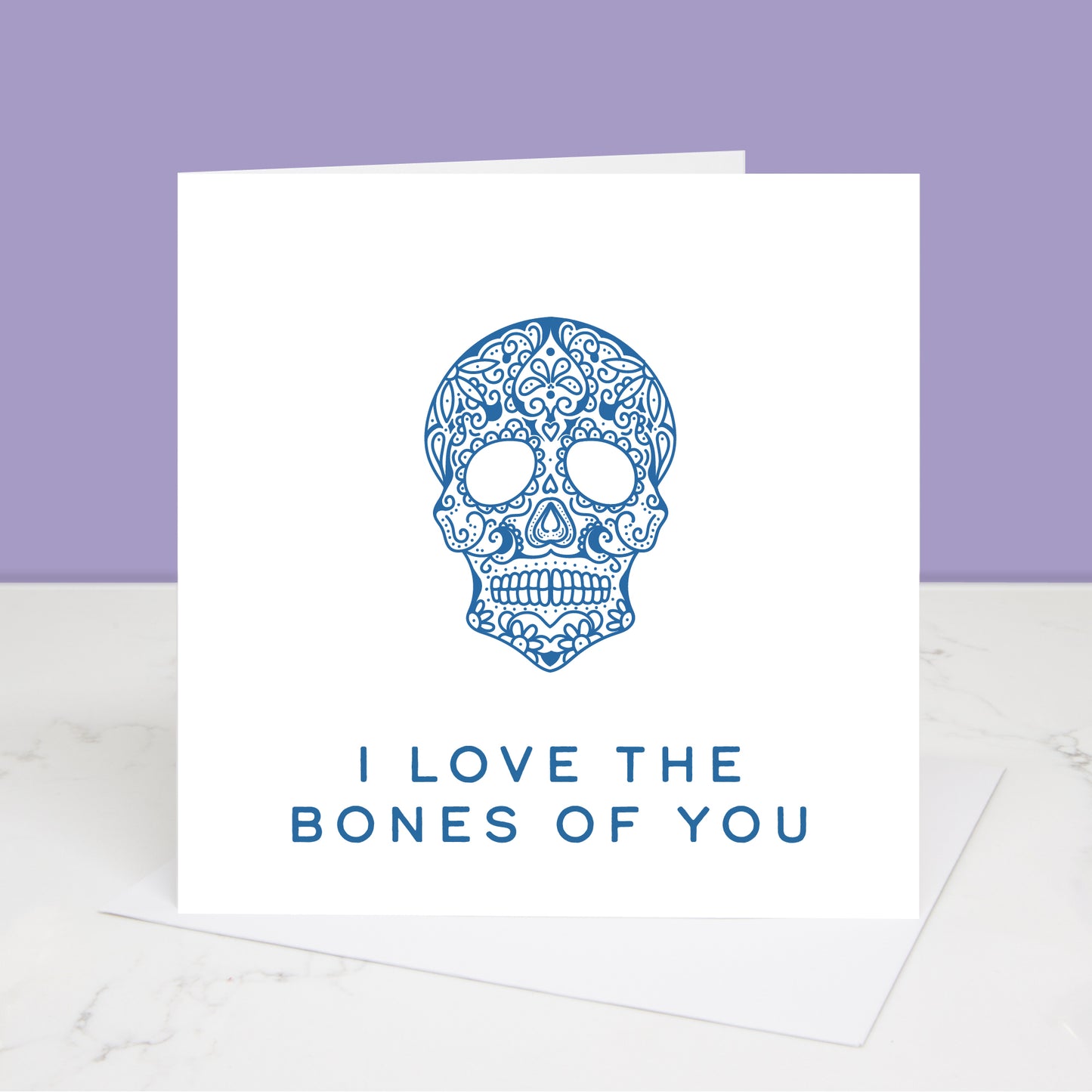 blue version of I love the bones of you Valentine's Day card with dia de los muertos skull Al images and designs © Slice of Pie Designs