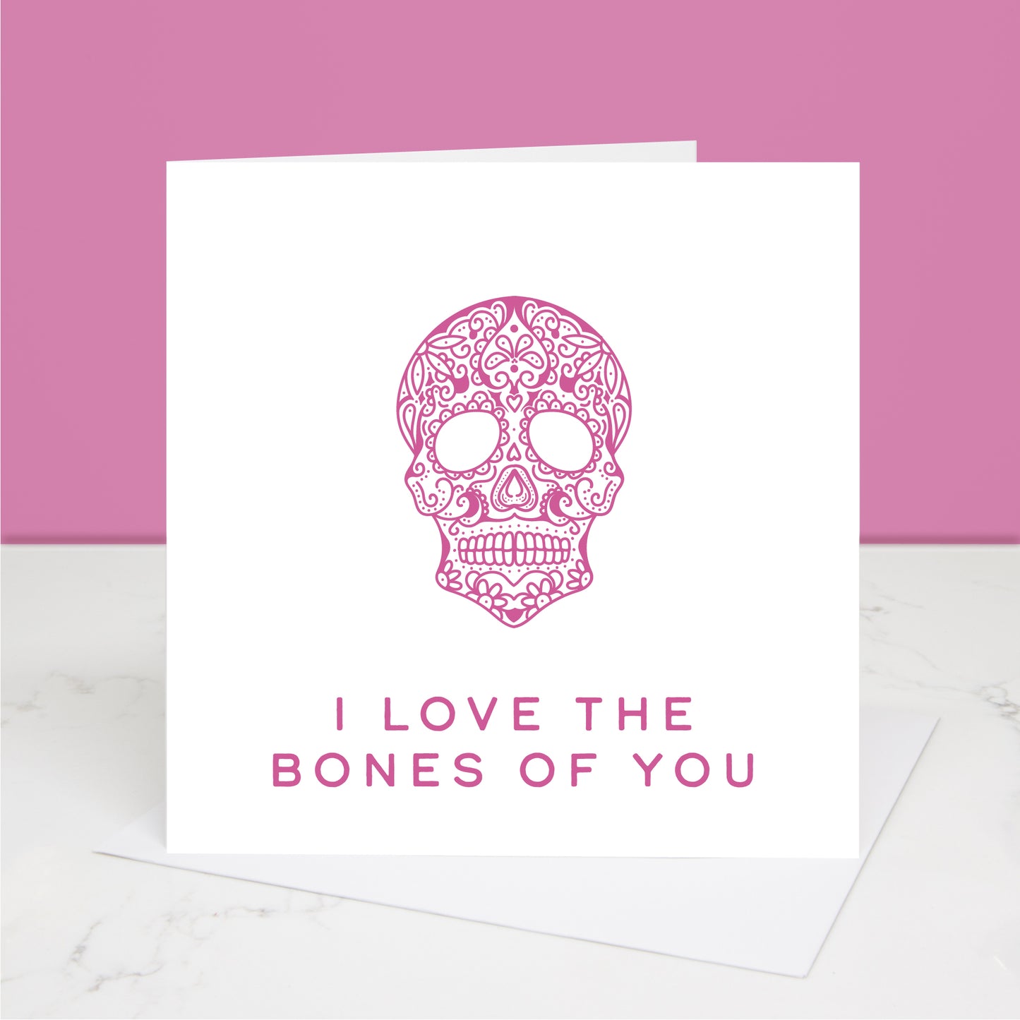 pink version of I love the bones of you Valentine's Day card with dia de los muertos skull Al images and designs © Slice of Pie Designs