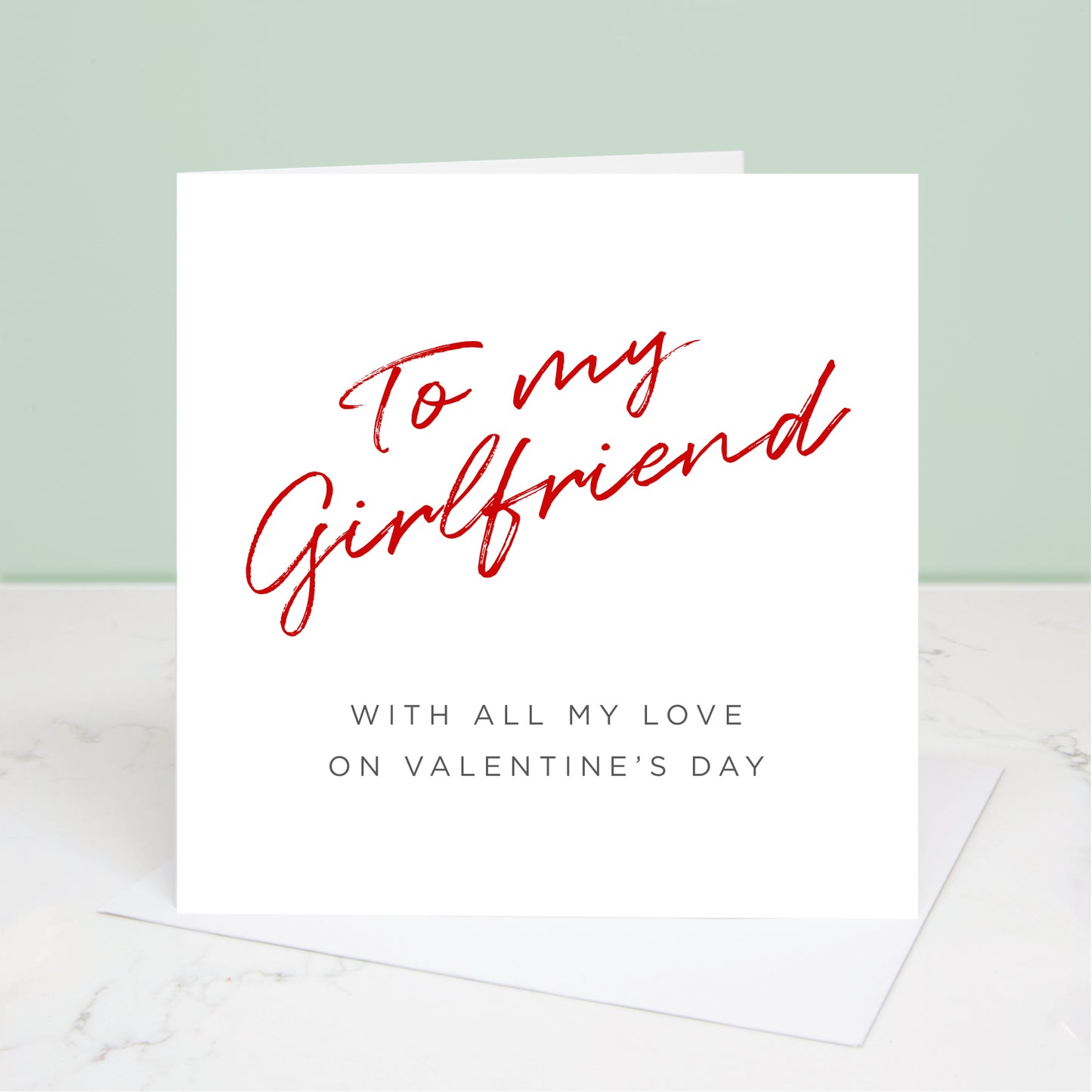 To my Girlfriend Valentine's Day card with 'To my Girlfriend' written in red at the top and the message 'with all my love on Valentine's Day' underneath. All images & designs © Slice of Pie Designs