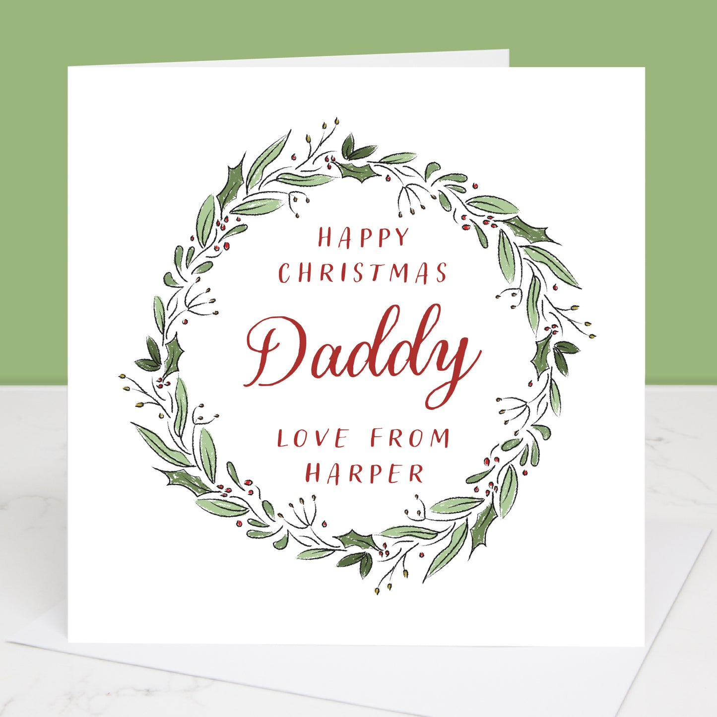 Daddy Christmas card with green wreath and red text on a white background