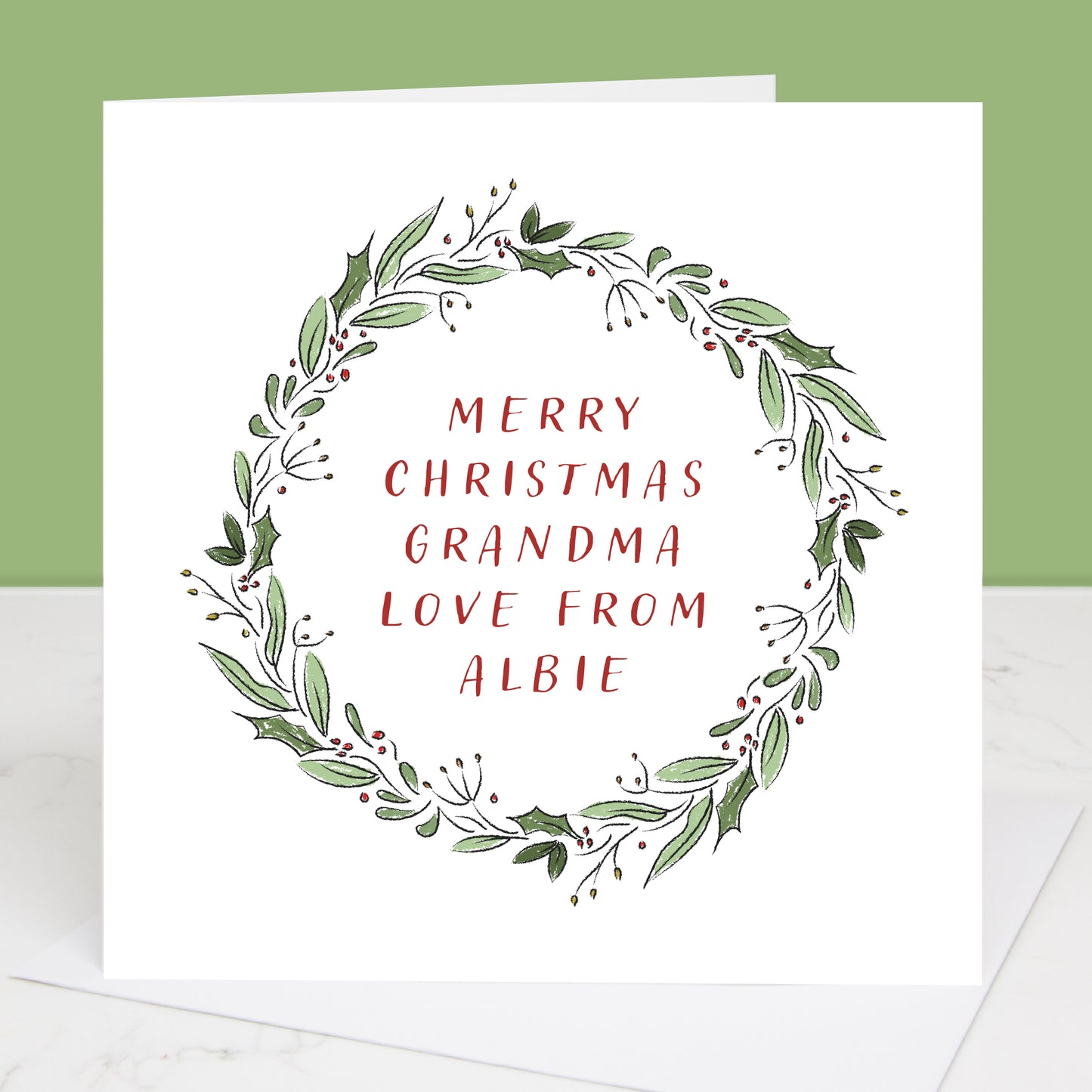 Christmas card for Grandparents with green wreath and red text on a white background