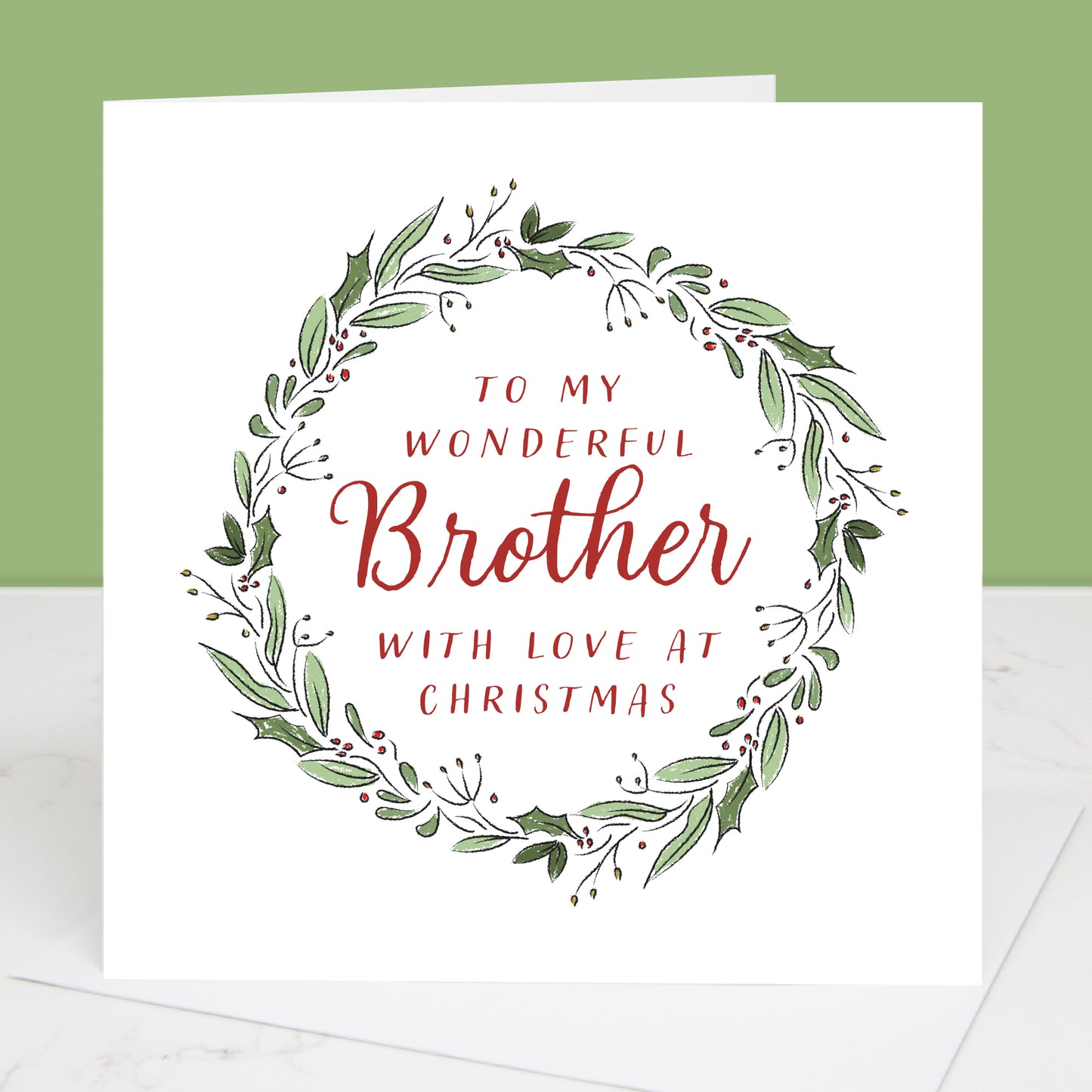 To my Brother christmas card with green leaf wreath and red text on a white background