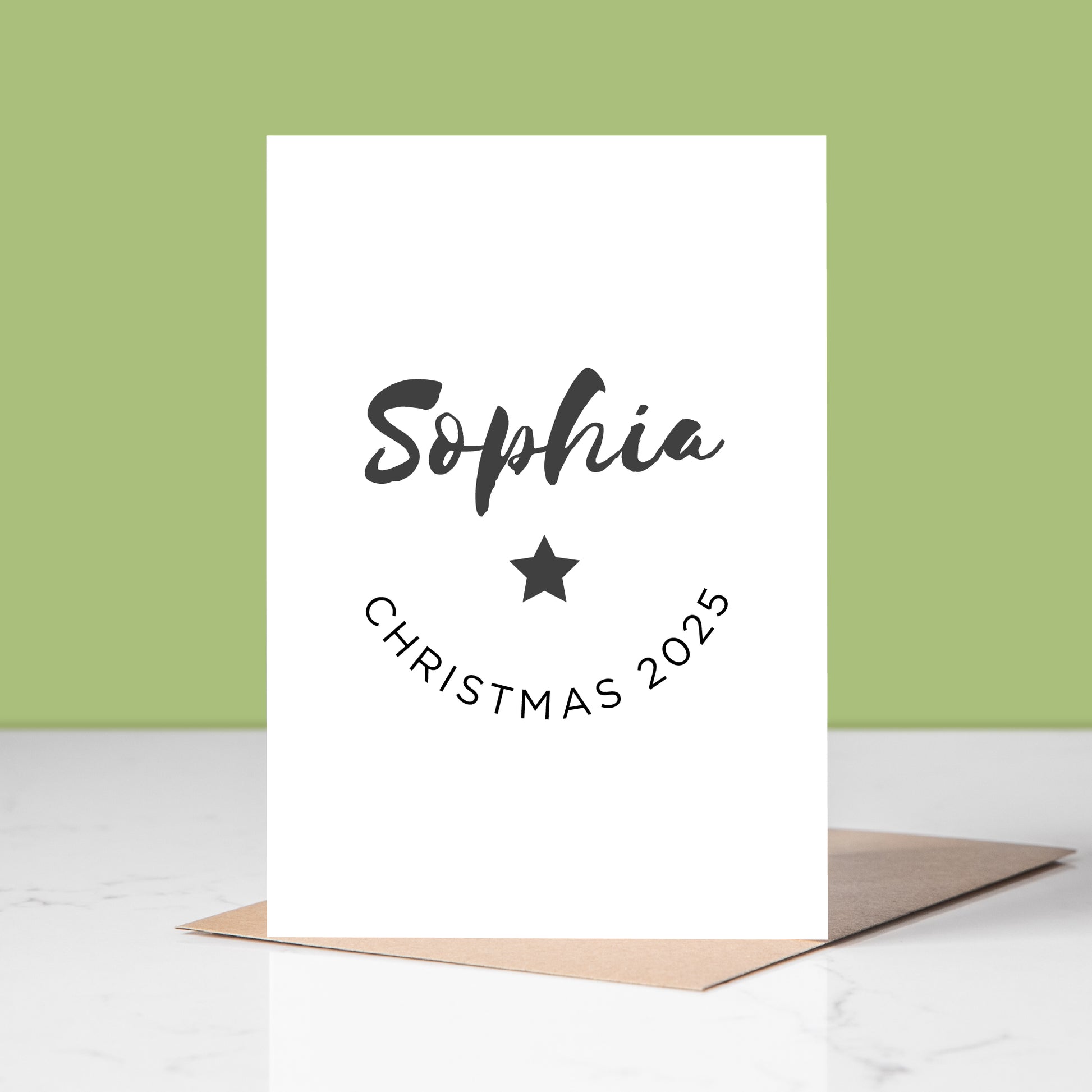White card with name and Christmas 2025 text on a light green background