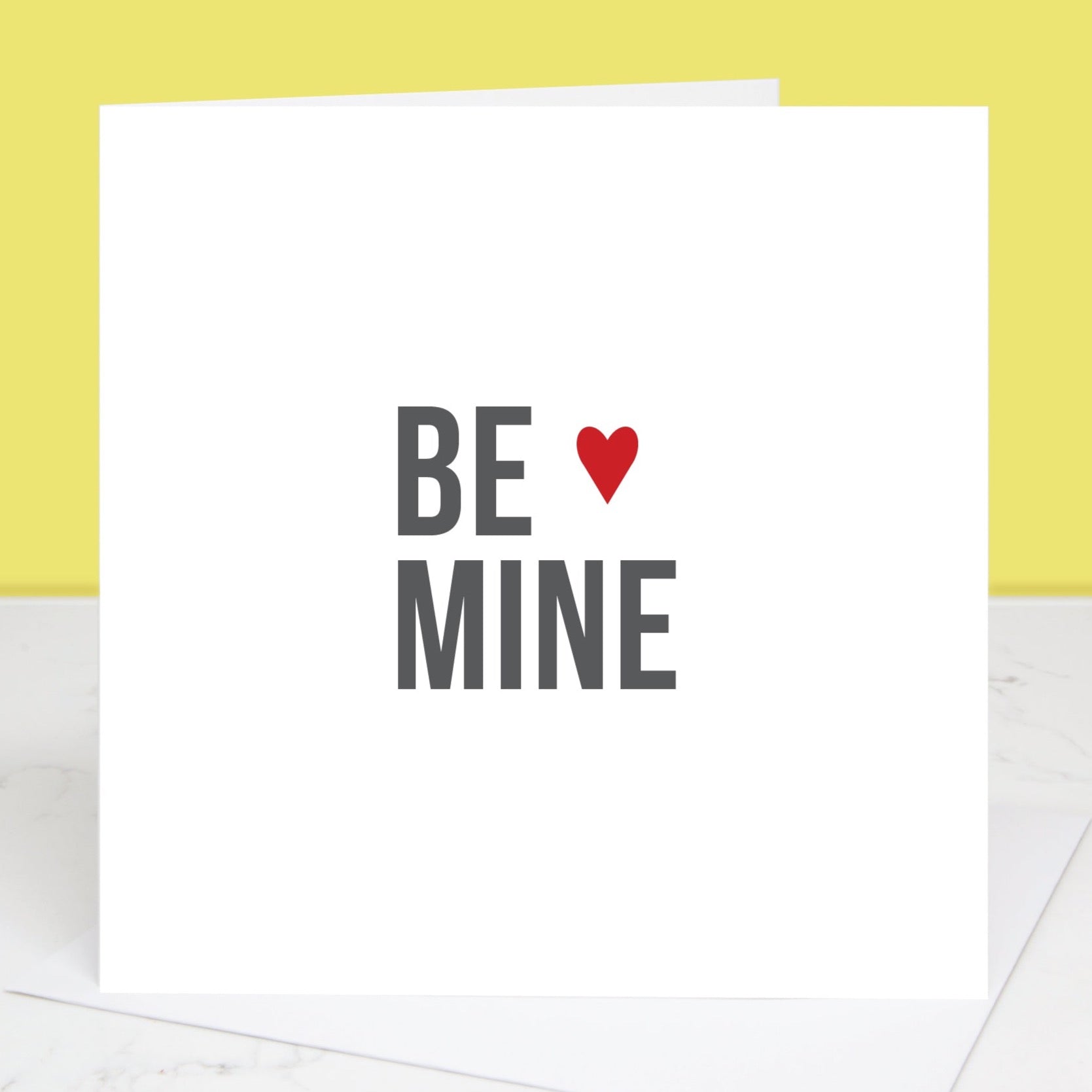 Valentine's Day card with Be Mine written in bold text with small red love heart. All images & designs © Slice of Pie Designs