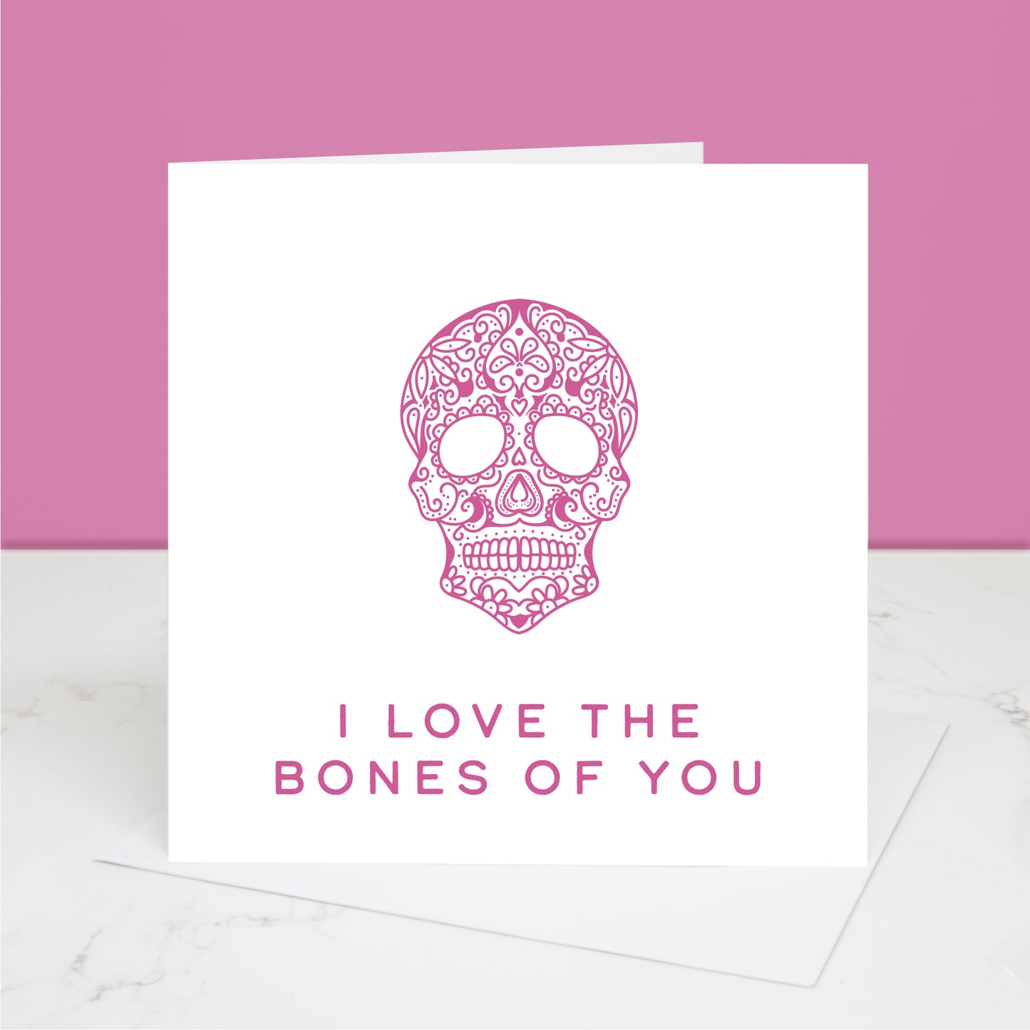 pink version of I love the bones of you Valentine's Day card with dia de los muertos skull Al images and designs ©  Slice of Pie Designs